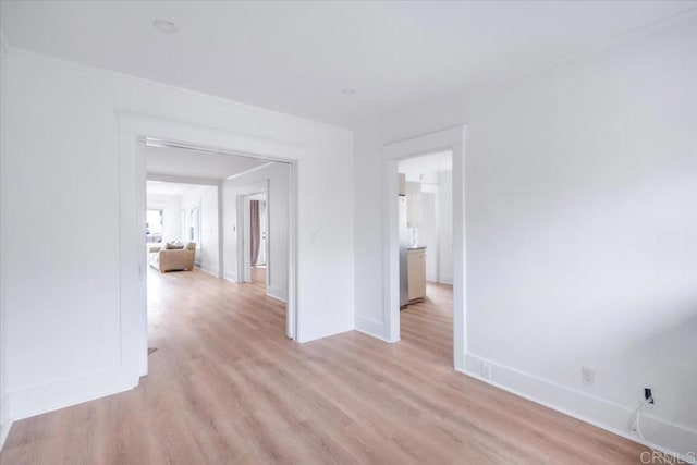 275 Euclid Ave, Long Beach, CA 90803 - empty room with baseboards and light wood-style flooring