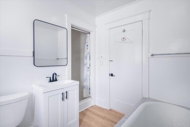 275 Euclid Ave, Long Beach, CA 90803 - bathroom featuring vanity, wood finished floors, ornamental molding, a bath, and a shower with shower curtain