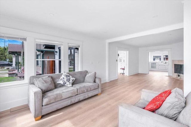 275 Euclid Ave, Long Beach, CA 90803 - living room featuring light wood finished floors and a fireplace