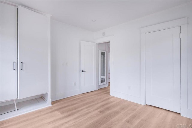 275 Euclid Ave, Long Beach, CA 90803 - unfurnished bedroom with light wood-style floors and a heating unit