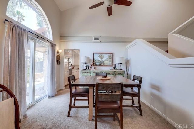 25322 Poderio Dr, Ramona, CA 92065 - dining room with light colored carpet, ceiling fan, and high vaulted ceiling