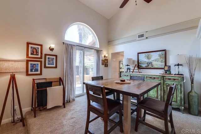 25322 Poderio Dr, Ramona, CA 92065 - dining space with light colored carpet, a ceiling fan, and high vaulted ceiling