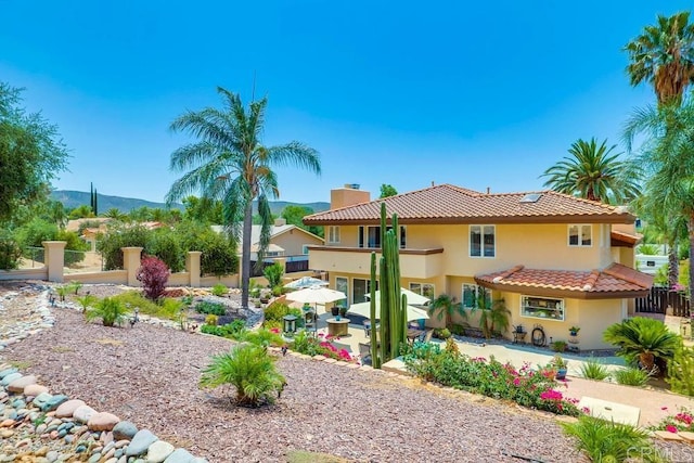 25322 Poderio Dr, Ramona, CA 92065 - view of front of home featuring stucco siding, a tiled roof, a patio area, and a chimney