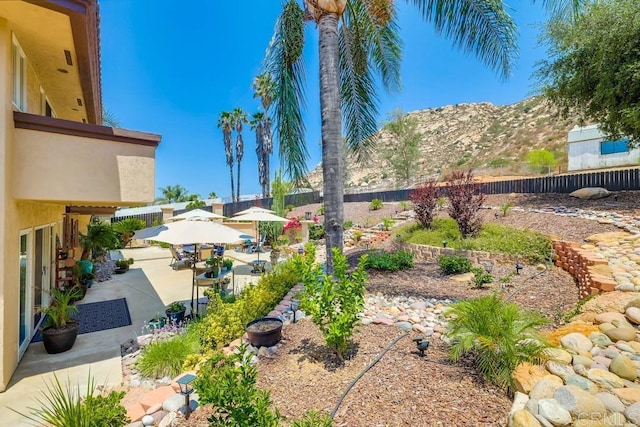 25322 Poderio Dr, Ramona, CA 92065 - fenced backyard featuring a mountain view and a patio area