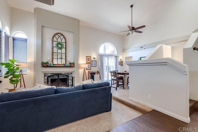 25322 Poderio Dr, Ramona, CA 92065 - living room with a high end fireplace, a ceiling fan, and wood finished floors