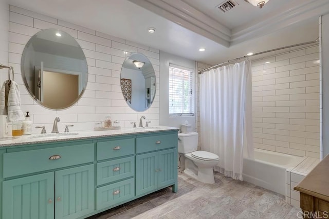 25322 Poderio Dr, Ramona, CA 92065 - bathroom with double vanity, shower / bath combination with curtain, wood finished floors, tile walls, and recessed lighting