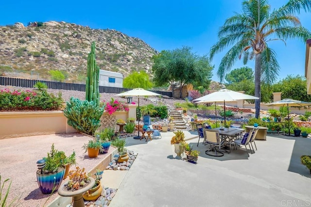 25322 Poderio Dr, Ramona, CA 92065 - view of patio / terrace with a mountain view, outdoor dining space, and stairway