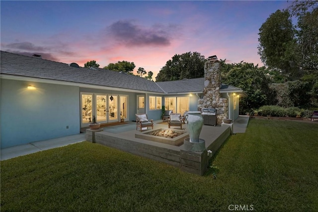 9858 Cullman Ave, Whittier, CA 90603 - back of property with french doors, a lawn, a chimney, a patio area, and a fire pit