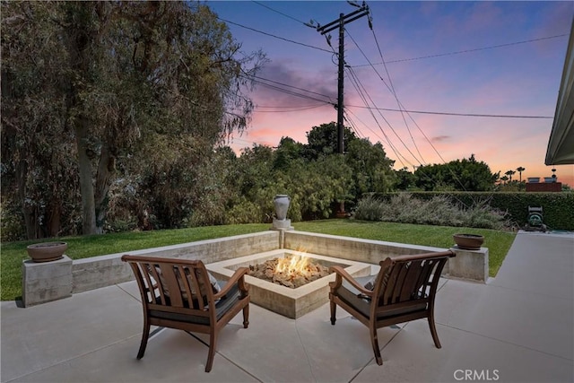 9858 Cullman Ave, Whittier, CA 90603 - patio terrace at dusk with an outdoor fire pit and a patio area