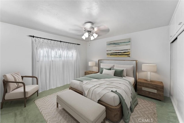 9858 Cullman Ave, Whittier, CA 90603 - bedroom with light carpet, a closet, and a ceiling fan