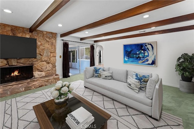9858 Cullman Ave, Whittier, CA 90603 - living room with light carpet, recessed lighting, a fireplace, beamed ceiling, and arched walkways