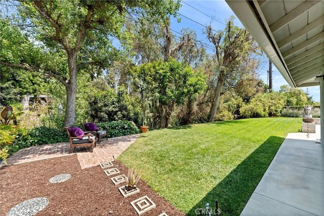9858 Cullman Ave, Whittier, CA 90603 - view of green lawn featuring a patio and view of wooded area