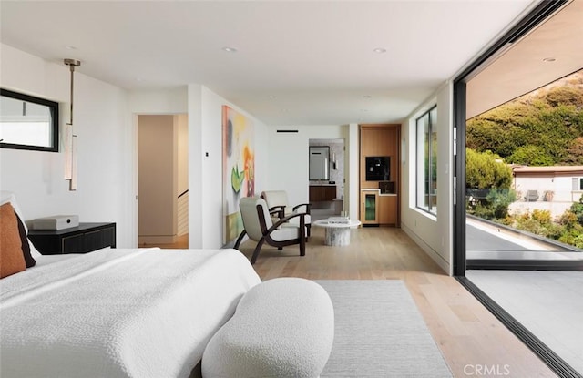 1105 Skyline Dr, Laguna Beach, CA 92651 - bedroom with light wood-style flooring and access to outside