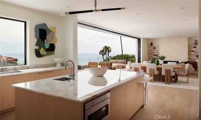 1105 Skyline Dr, Laguna Beach, CA 92651 - kitchen featuring stainless steel microwave, modern cabinets, light wood-type flooring, and plenty of natural light