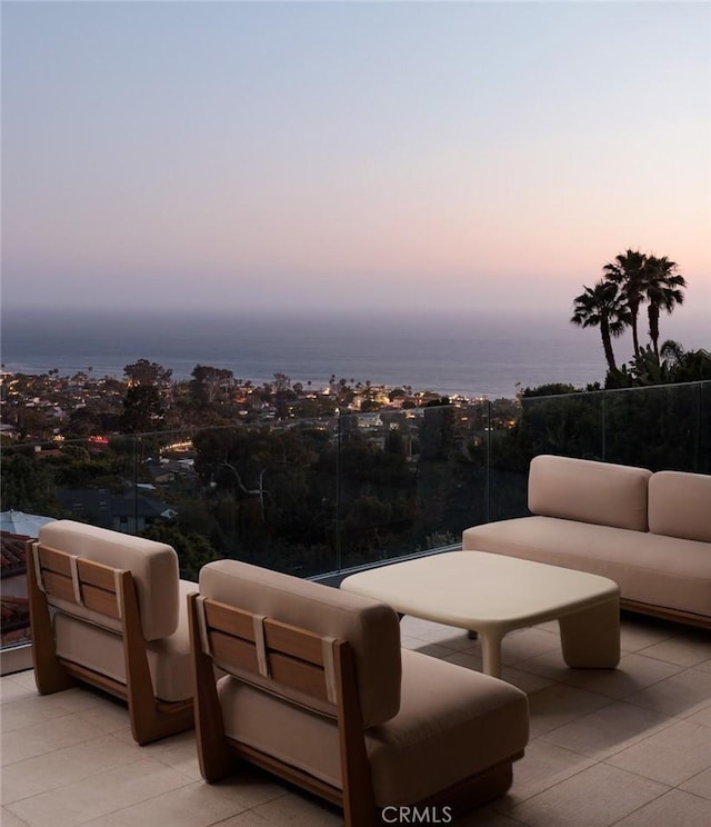 1105 Skyline Dr, Laguna Beach, CA 92651 - patio terrace at dusk featuring a balcony and an outdoor living space