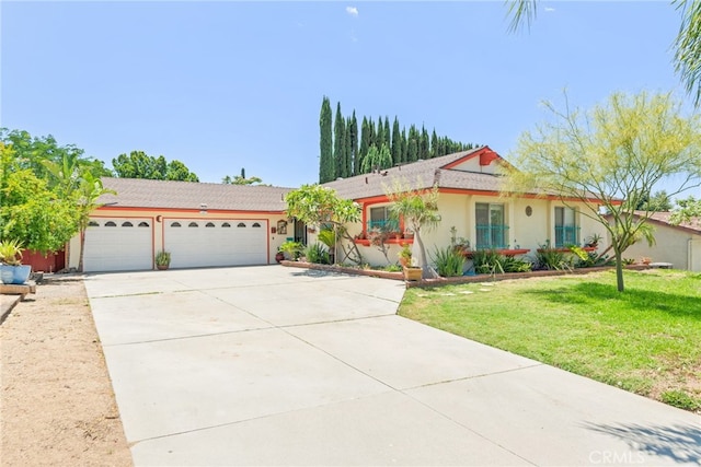 252 W Blaine St, Riverside, CA 92507 - ranch-style home featuring an attached garage, driveway, a front yard, and stucco siding