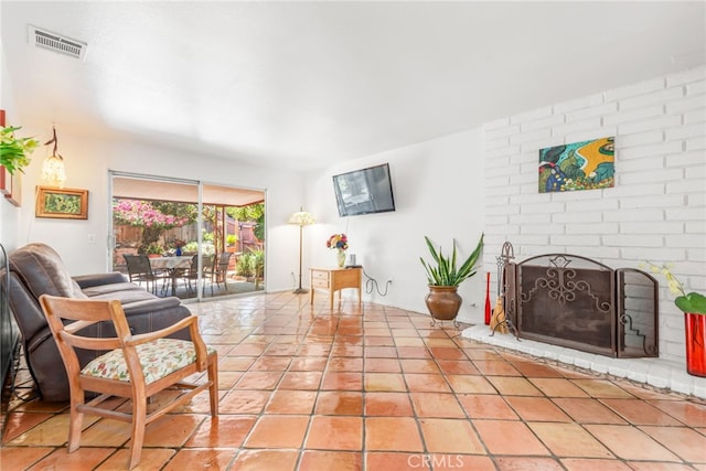 252 W Blaine St, Riverside, CA 92507 - living area featuring a fireplace and light tile patterned flooring