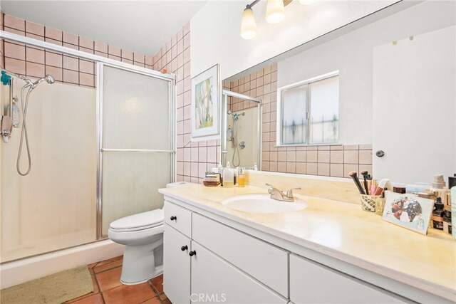 252 W Blaine St, Riverside, CA 92507 - full bath with vanity, a shower stall, and tile patterned floors