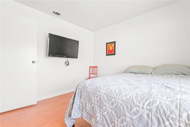 252 W Blaine St, Riverside, CA 92507 - bedroom with light wood finished floors and baseboards