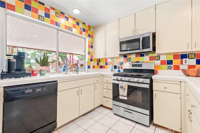 252 W Blaine St, Riverside, CA 92507 - kitchen featuring appliances with stainless steel finishes, light countertops, decorative backsplash, and white cabinets