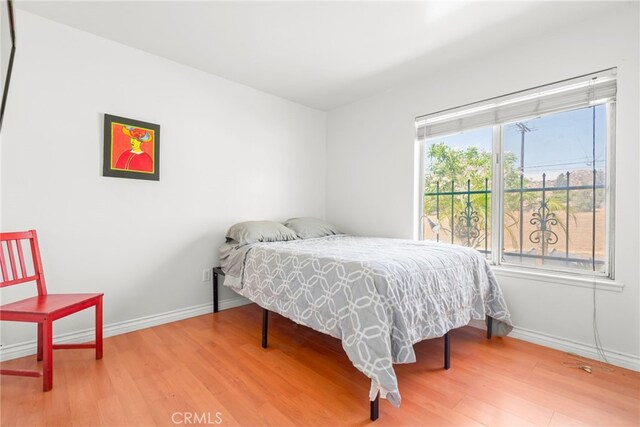 252 W Blaine St, Riverside, CA 92507 - bedroom with wood finished floors and baseboards