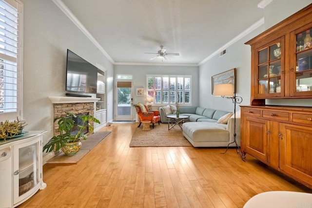 6707 Ketch Way, Carlsbad, CA 92011 - living area with ceiling fan, ornamental molding, light wood-style floors, and a fireplace