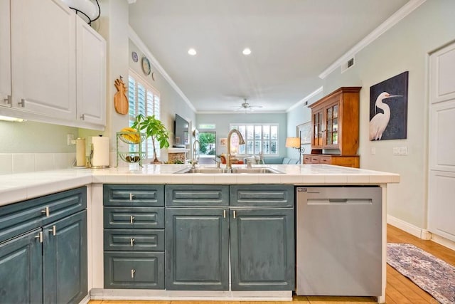 6707 Ketch Way, Carlsbad, CA 92011 - kitchen featuring stainless steel dishwasher, ornamental molding, white cabinets, a peninsula, and tile countertops
