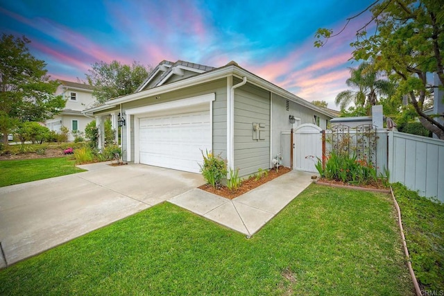 6707 Ketch Way, Carlsbad, CA 92011 - garage at dusk with driveway and a gate