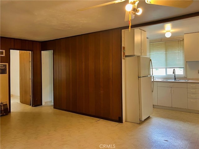 5128 W State Highway 20, Upper Lake, CA 95485 - kitchen featuring freestanding refrigerator, light floors, wooden walls, ceiling fan, and light countertops