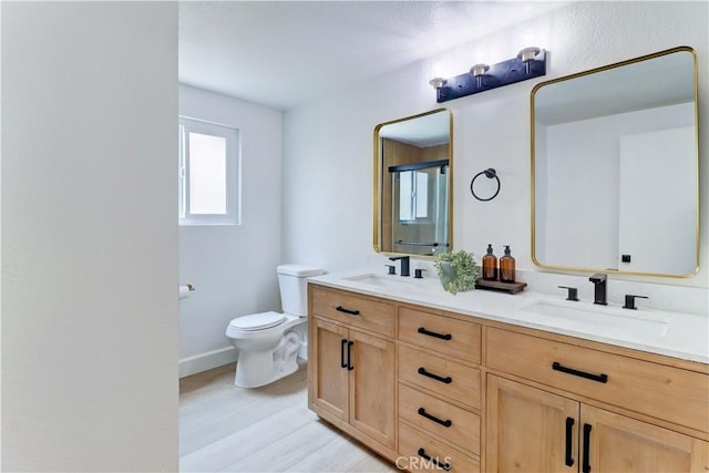 8312 Bellhaven St, La Palma, CA 90623 - full bathroom with double vanity and wood finished floors