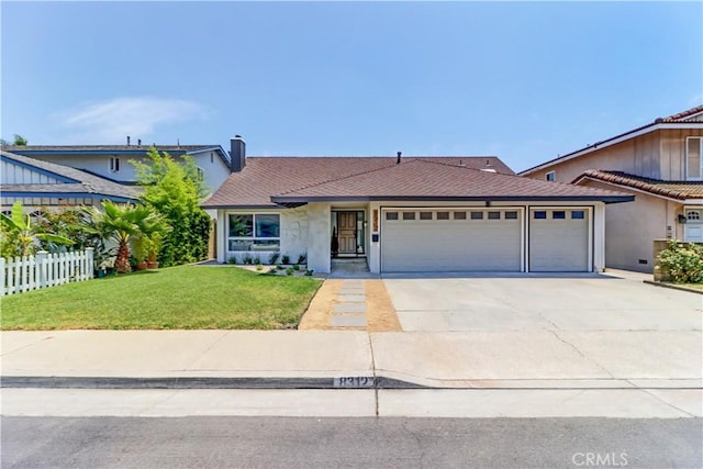 8312 Bellhaven St, La Palma, CA 90623 - view of front of house featuring an attached garage, driveway, a chimney, and stucco siding