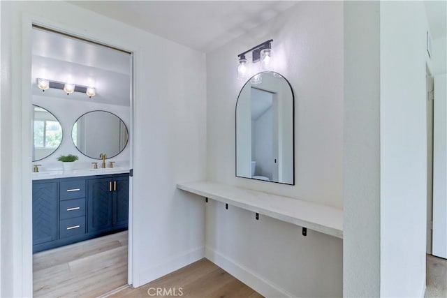 8312 Bellhaven St, La Palma, CA 90623 - bathroom featuring wood finished floors and vanity