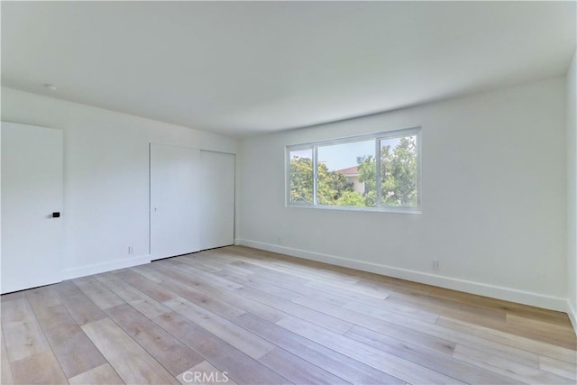 8312 Bellhaven St, La Palma, CA 90623 - unfurnished bedroom with light wood-style floors and a closet