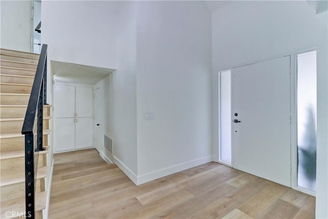 8312 Bellhaven St, La Palma, CA 90623 - entrance foyer with a towering ceiling, stairway, and wood finished floors