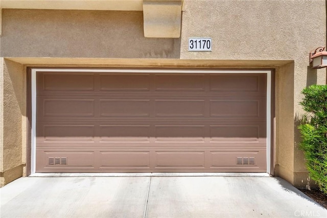 31170 Strawberry Tree Ln Unit 67, Temecula, CA 92592 - garage featuring concrete driveway