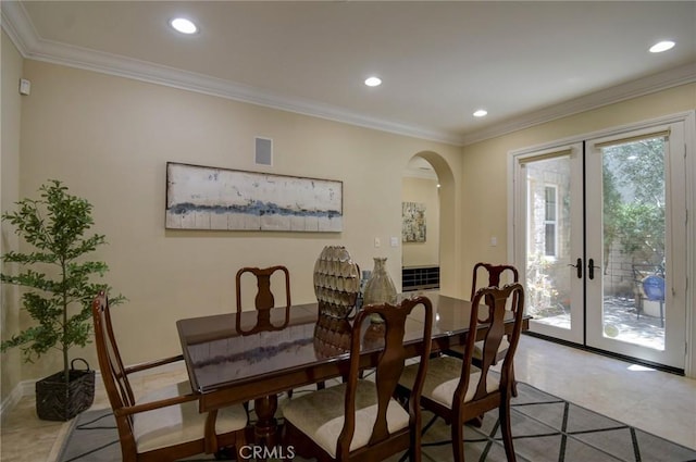 62 Gentry, Irvine, CA 92620 - tiled dining space with french doors, arched walkways, recessed lighting, and crown molding