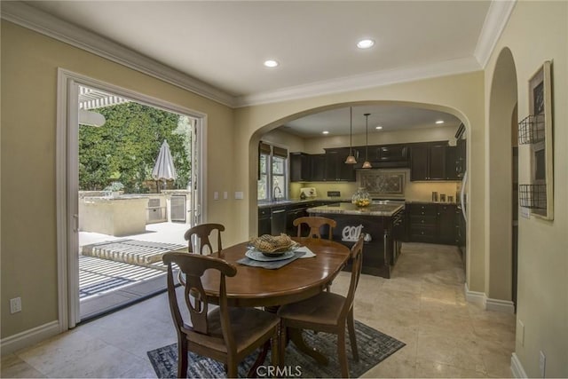 62 Gentry, Irvine, CA 92620 - dining room featuring arched walkways, ornamental molding, and recessed lighting