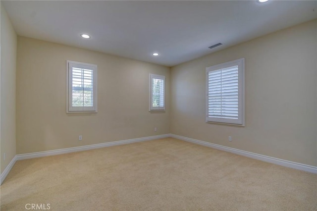 62 Gentry, Irvine, CA 92620 - spare room featuring recessed lighting, light carpet, and plenty of natural light