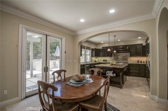 62 Gentry, Irvine, CA 92620 - dining space with arched walkways, french doors, recessed lighting, and crown molding
