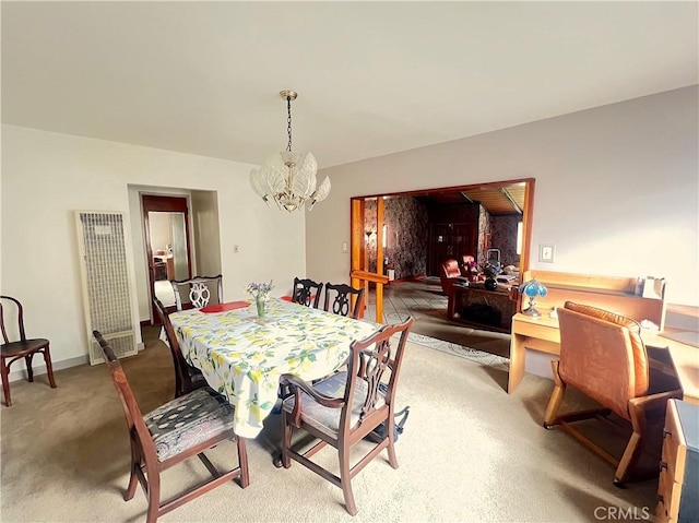407 S Northwood Ave, Compton, CA 90220 - dining room with a heating unit, a chandelier, and carpet floors