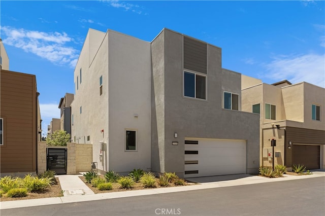 27216 W Coyote Bush Ct, Valencia, CA 91355 - contemporary house featuring stucco siding and an attached garage