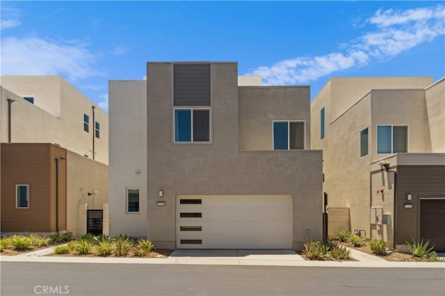 27216 W Coyote Bush Ct, Valencia, CA 91355 - view of front of house with an attached garage and stucco siding