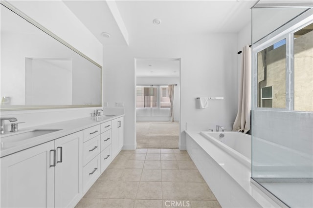 27216 W Coyote Bush Ct, Valencia, CA 91355 - full bath with a bath, double vanity, and tile patterned flooring