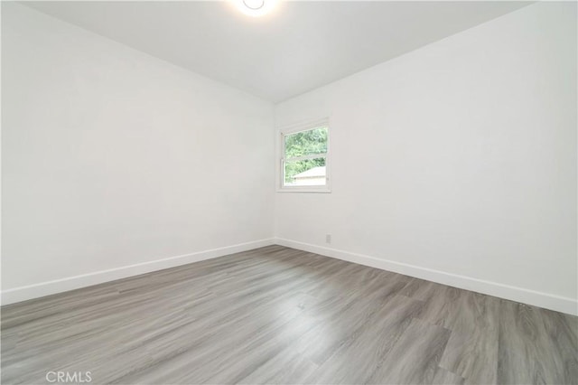 2058 N Pico Ave, San Bernardino, CA 92411 - spare room featuring baseboards and wood finished floors