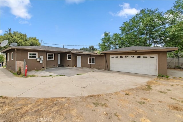 2058 N Pico Ave, San Bernardino, CA 92411 - view of front of property featuring concrete driveway, an attached garage, and stucco siding