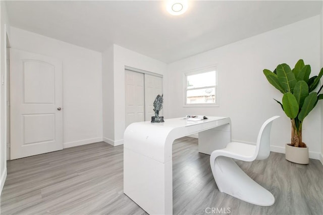 2058 N Pico Ave, San Bernardino, CA 92411 - office area with baseboards and light wood finished floors