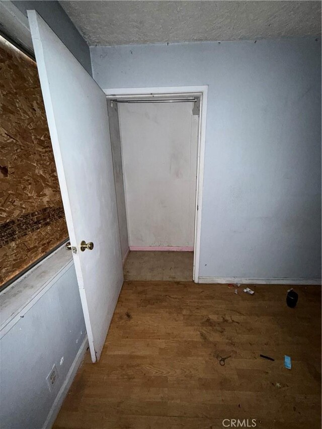 2915 Lanning Ave, Redding, CA 96001 - spare room with wood finished floors and a textured ceiling