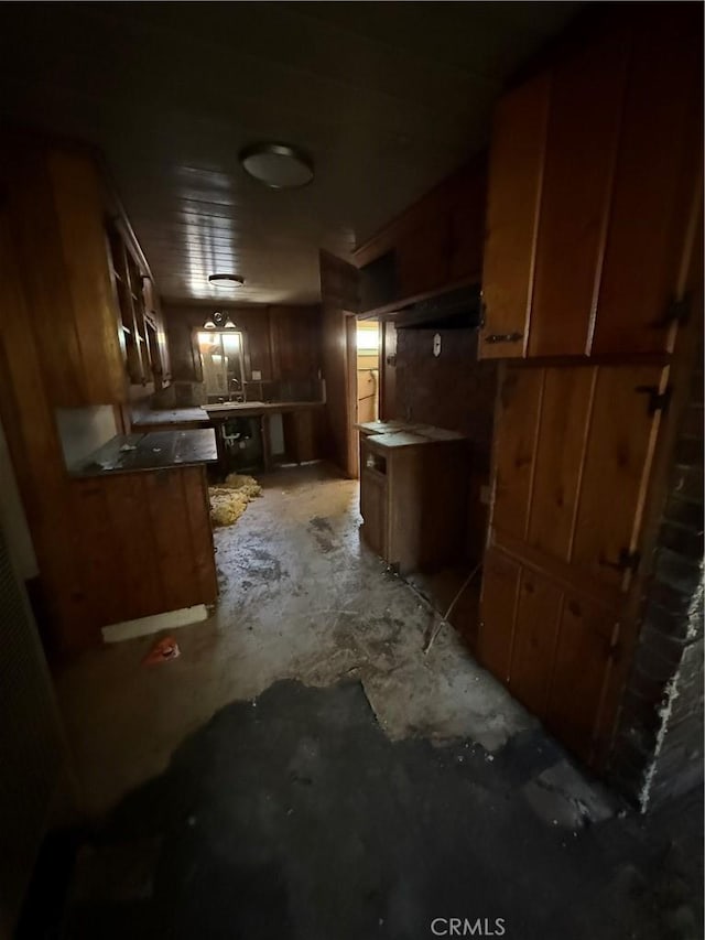 2915 Lanning Ave, Redding, CA 96001 - kitchen with brown cabinets and unfinished concrete floors
