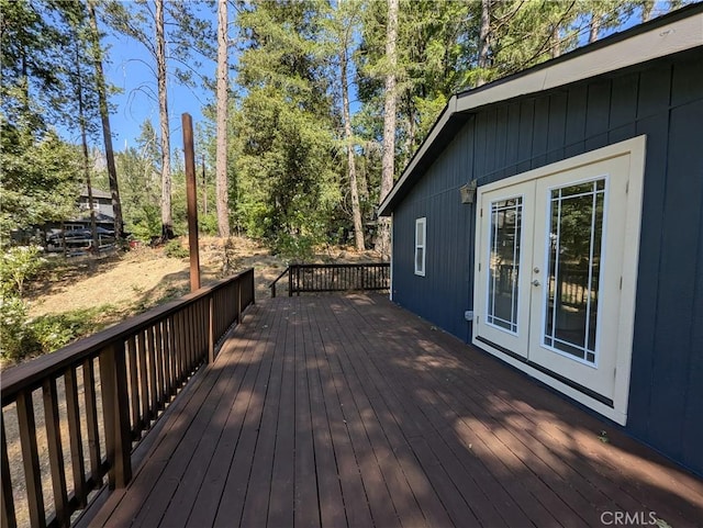 16121 Golf Rd, Cobb, CA 95426 - wooden terrace with french doors and view of wooded area