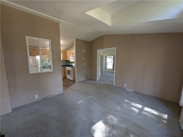16121 Golf Rd, Cobb, CA 95426 - unfurnished living room with vaulted ceiling and light carpet